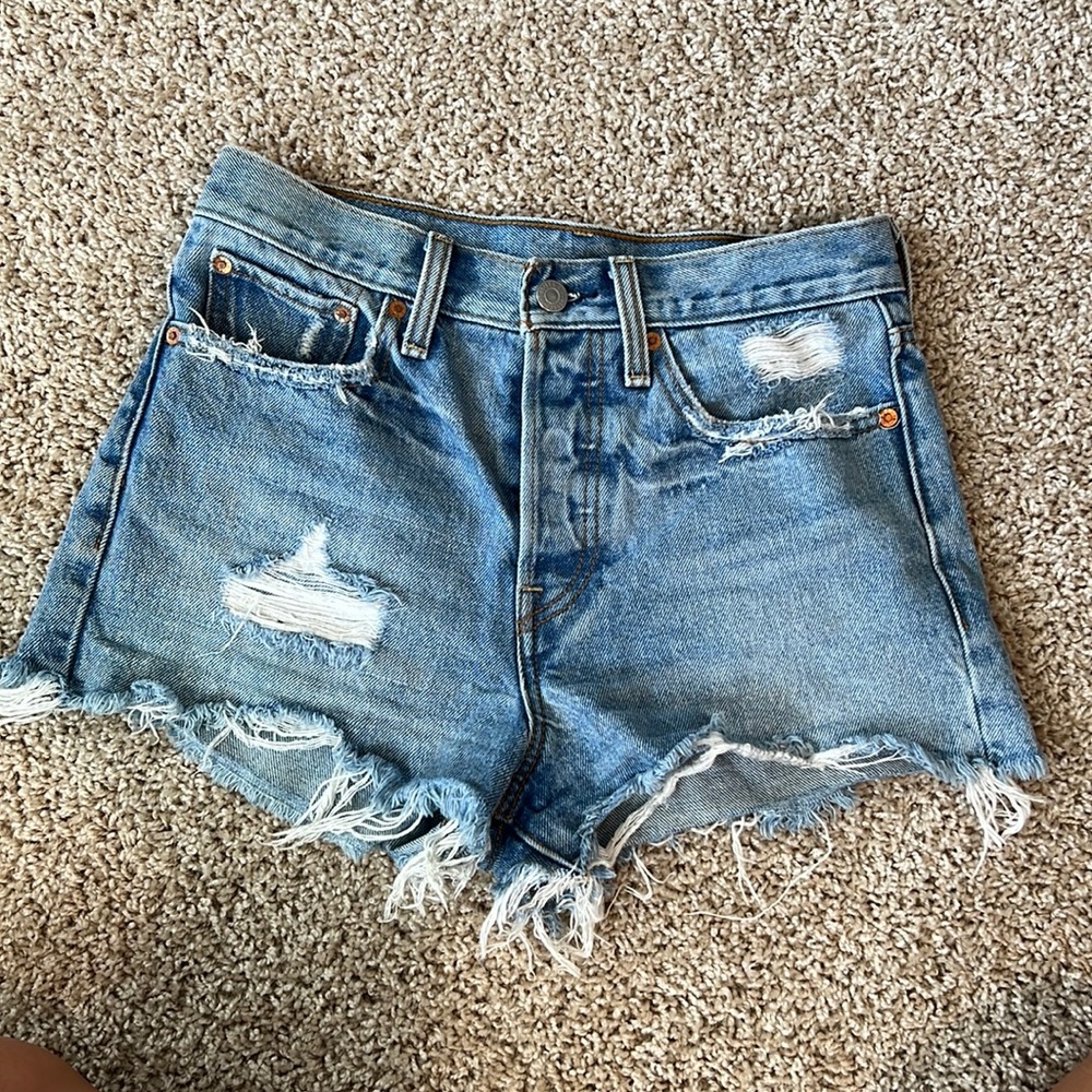Levis jean shorts. Medium blue. Distressed. Size 27